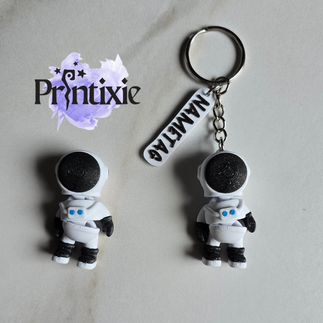 Tiny Astronaut 3D Printed keychain with nametag - Made by Printixie
