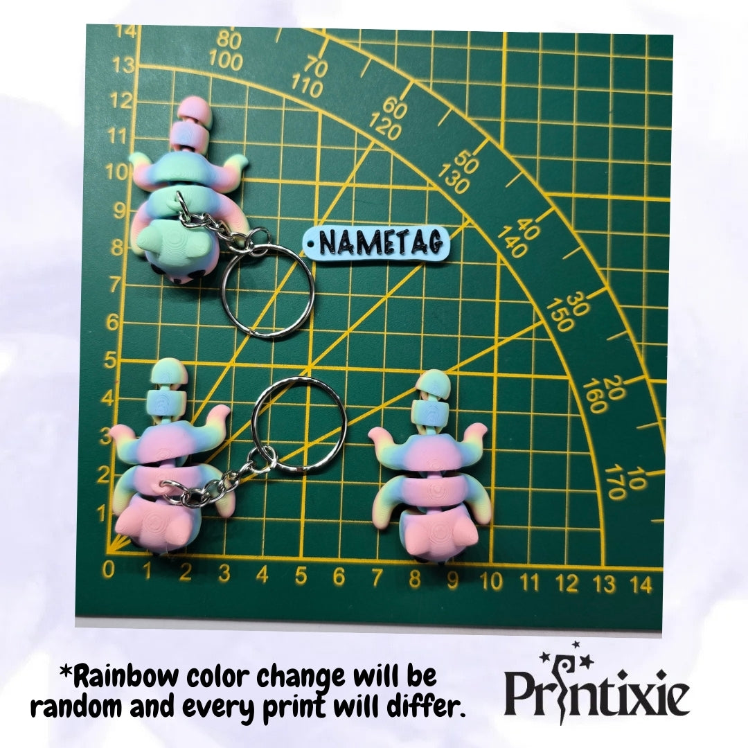 Rainbow 3D printed tiny cat keychain and flexible toy, size, made by Printixie