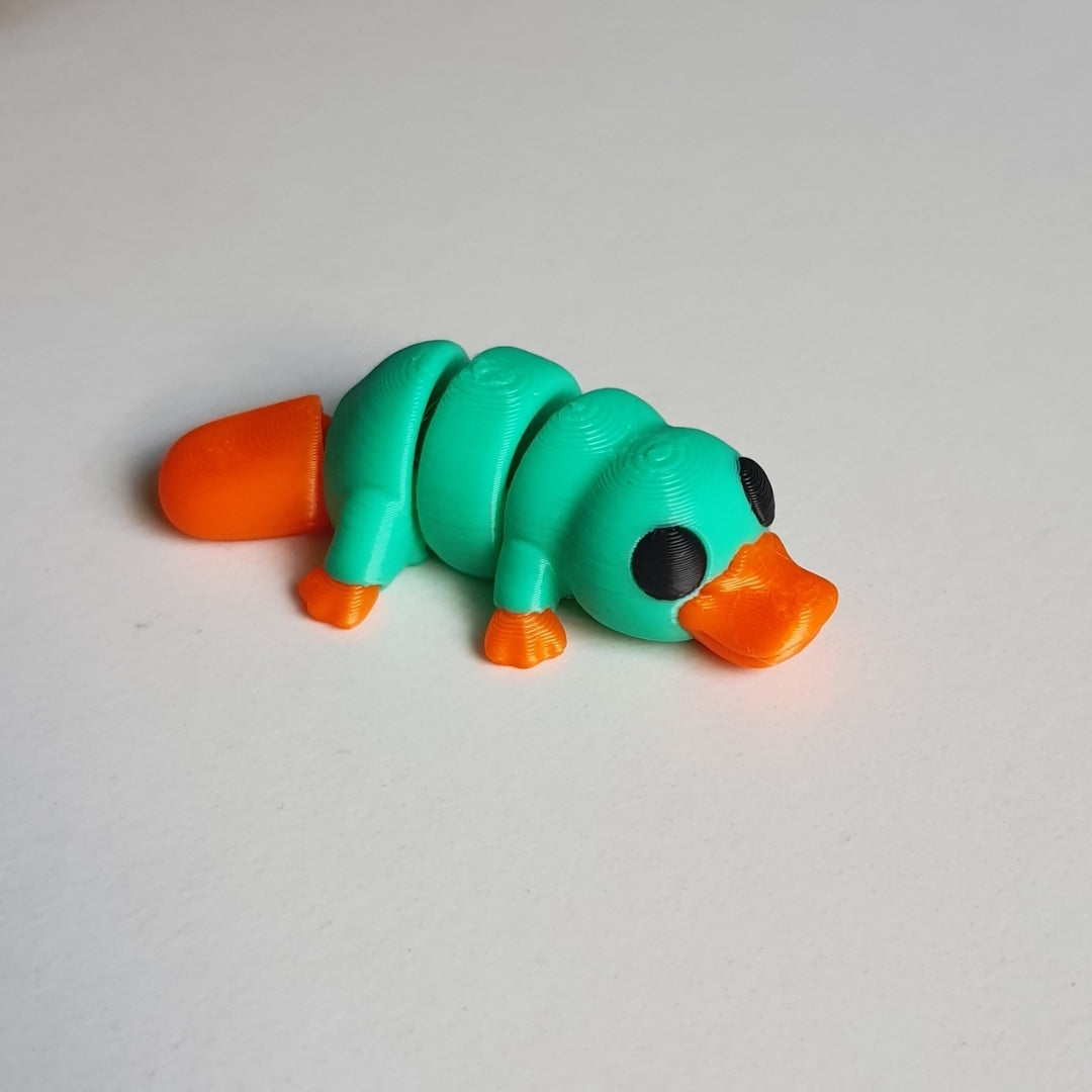 Tiny Platypus – a cute and flexible 3D printed toy. Made by Printixie