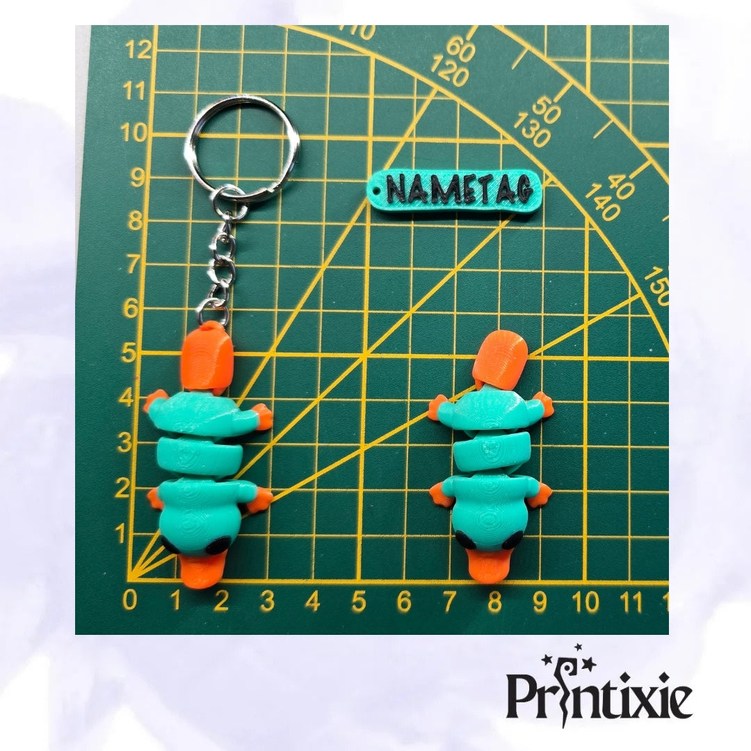 Tiny Platypus – a cute and flexible 3D printed toy and keychain. -Size Made by Printixie